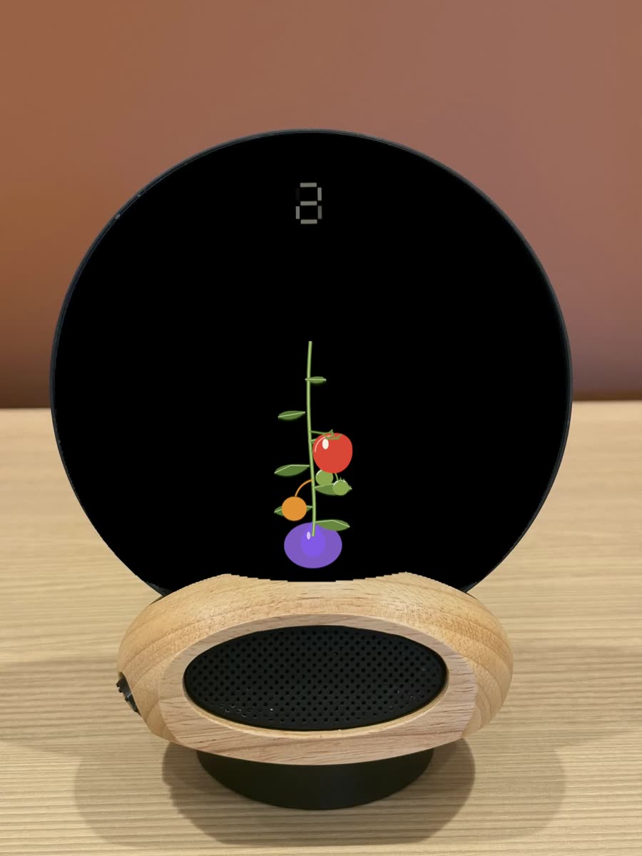 Morph on a desk: a tomato plant grows on the glass while the 25 minutes run; when it is ripe Morph asks whether to keep going instead of ringing