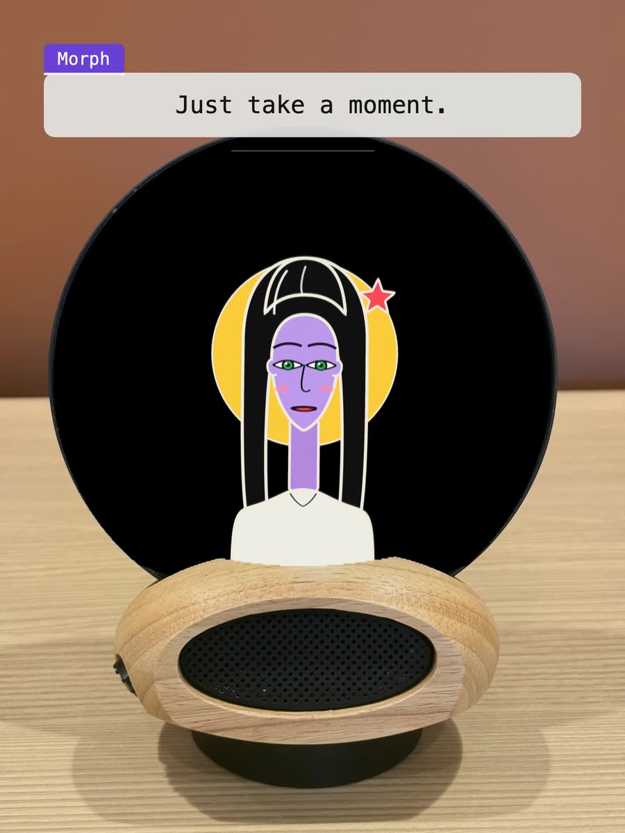 Morph on a desk: the character on the glass asks for one word for the day, waits while you find it, and keeps it for you